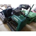 A QUALCAST CLASSIC 35S MOWER AND SCARIFIER.