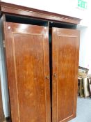 A VICTORIAN MAHOGANY WARDROBE.