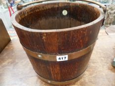 A LISTER COPPERED OAK BRASS BOUND BUCKET.