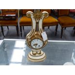 FRENCH ORMOLU MOUNTED MARBLE LYRE FORM CLOCK.