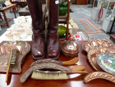 FOUR ART NOUVEAU CRUMB TRAY AND BRUSH SETS, A COPPER LIDDED VESSEL AND A PAIR OF RIDING BOOTS.