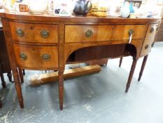 A GOOD LATE GEORGIAN MAHOGANY AND BOXWOOD STRUNG BOW FRONT SIDEBOARD.