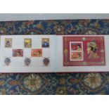 BOXED STAMP ALBUM FROM BHUTAN.