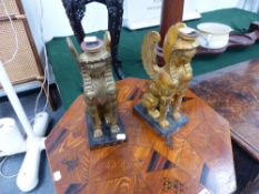 A PAIR OF CANDLESTICKS IN THE EGYPTIAN MANNER.