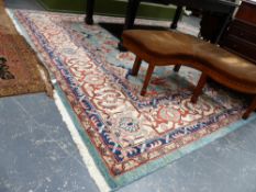 A LARGE HAND WOVEN EASTERN CARPET.