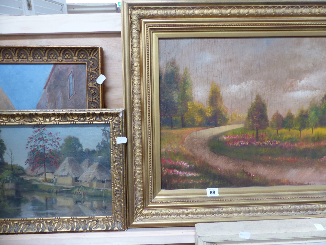 AN OIL ON BOARD CONTINENTAL PARK AND TWO OIL ON CANVAS EASTERN SCENES.