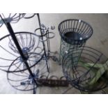 VARIOUS WROUGHT IRON PLANTERS AND A CHAIR.