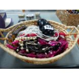 BASKET OF VARIOUS COSTUME JEWELLEY.