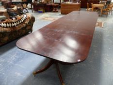 A LARGE MAHOGANY FOUR PILLAR DINING TABLE.