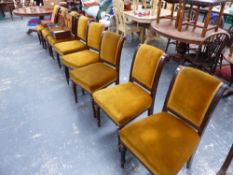 A SET OF EIGHT LATE VICTORIAN OAK FRAMED DINING CHAIRS.