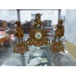 A GILT SPELTER FRENCH CLOCK GARNITURE WITH SEVRES TYPE PORCELAIN PLAQUES.