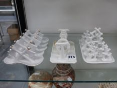 THREE WHITE PORCELAIN TOAST RACKS.