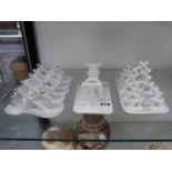 THREE WHITE PORCELAIN TOAST RACKS.