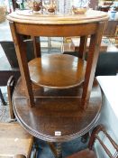 AN OAK GATELEG TABLE WITH BARLEY TWIST LEGS AND AN ART DECO OCCASIONAL TABLE.