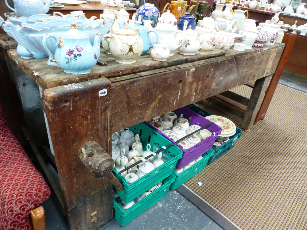 A LARGE VINTAGE WORK BENCH.