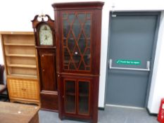 AN EDWARDIAN MAHOGANY CORNER CABINET.