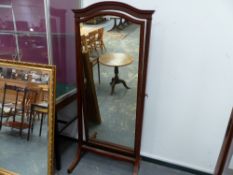 AN EDWARDIAN MAHOGANY CHEVAL MIRROR BY HOWARD & SONS.