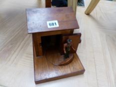 A HAND MADE TREEN CIGARETTE DISPENSER.