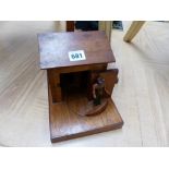 A HAND MADE TREEN CIGARETTE DISPENSER.