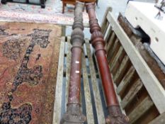 A PAIR OF ANTIQUE MAHOGANY COLUMNS.