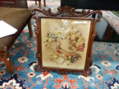 A VICTORIAN ROSEWOOD POLE SCREEN WITH NEEDLEPOINT PANEL.