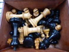 A BOXED EBONY AND BOX WOOD CHESS SET.