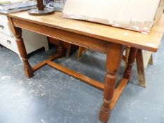 A SMALL OAK REFECTORY TYPE TABLE.
