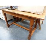 A SMALL OAK REFECTORY TYPE TABLE.