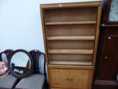 A MID CENTURY SATINBIRCH BOOKCASE.