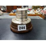 A HALLMARKED SILVER INKWELL ON HORN BASE.