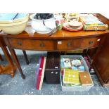 A REGENCY STYLE BOW FRONT SIDE TABLE.