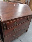 A LATE GEORGIAN MAHOGANY FALL FRONT BUREAU.