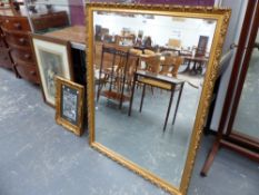 A LARGE GILT FRAMED MIRROR.