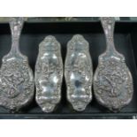 A HALLMARKED SILVER FOUR PIECE DRESSING TABLE SET, DATED BIRMINGHAM 1908.