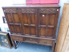 AN OAK SIDE CABINET.