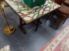 A FOLDING TABLE WITH NEEDLEPOINT TOP.