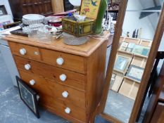 A VICTORIAN PINE CHEST OF DRAWERS.