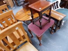 A LARGE PINE COFFEE TABLE, TWO OAK STOOLS AND AN UPHOLSTERED STOOL.