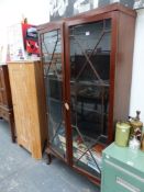 A LARGE GLAZED BOOKCASE.