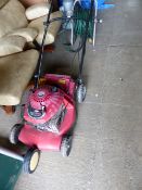 A BRIGGS & STRATTON LAWN MOWER.