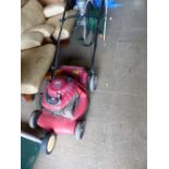 A BRIGGS & STRATTON LAWN MOWER.