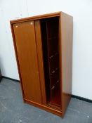 A MODERN TEAK WARDROBE.