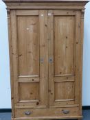 A CONTINENTAL PINE WARDROBE.