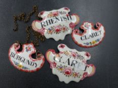 THREE ENAMELLED DECANTER LABELS.