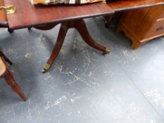 A LATE GEORGIAN MAHOGANY EXTENDING BREAKFAST TABLE.