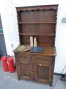 A SMALL OAK DRESSER.