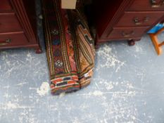 A VINTAGE HAND WOVEN EASTERN RUG.