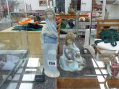 TWO LLADRO FIGURINES.