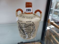 A LOCKE'S IRISH WHISKEY 4/5 QUART POTTERY BOTTLE.