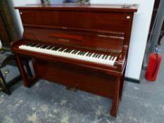 A CHALLEN UPRIGHT PIANO WITH IRON OVERSTRUNG FRAME.